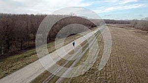 Man running in the nature. Healthy lifestyle. Running, outdoor sports. Aerial view.
