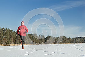 Man running outdoors in winter snowy day