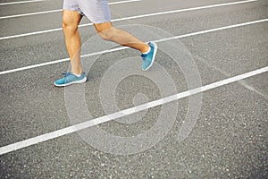 Man running on a racing track