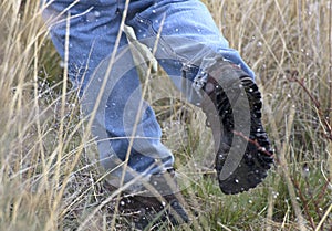 Man running in snow legs and boots only