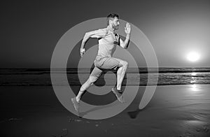 Man running at sunset. Full length of healthy man running and sprinting outdoors. Male runner. Fit man fitness model