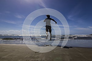 Man running to the water of mediterranean sea