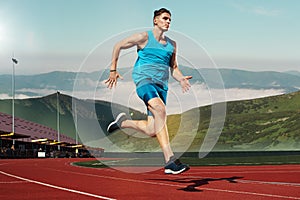 Man running in the track. Fit male fitness runner jogging in stadium