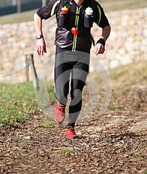 Man runs with sportwear during a cross-country race