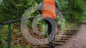 Man Runs Up A Set Of Stairs In the Park. man jogging the stairs in park. Soft Focus