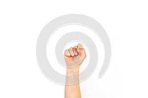 Man`s arm with clenched fist on a white background