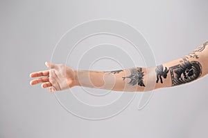Man`s arm with stylish tattoos photo