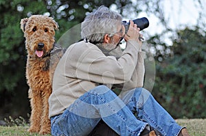 Man's best friend. Photographer and Airedale dog.