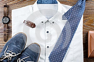 Man`s classic clothes outfit flat lay with formal shirt, tie, shoes and accessories.