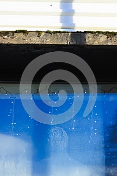 Man`s dummy in a blue window.