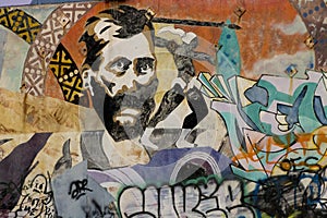 Man's Face Painted on Graffiti Wall