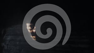 Mysterious portrait of man with light and shadow on face