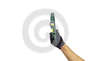 A man`s gloved hand holds a spirit level