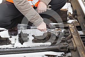 Man's hand with adjustable wrench