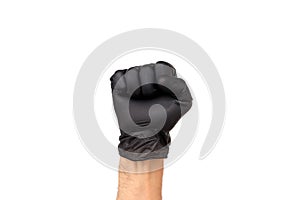 Man`s hand in a black glove is clenched into a fist. Isolate on
