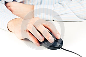 Man's hand on computer mouse