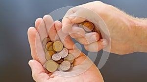 Man`s hand counting euro cent coins