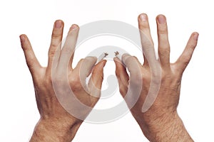 Man's hand crushing cigarettes