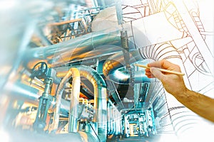 Man`s hand draws a design of factory combined with photo