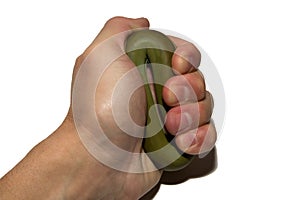 Man`s hand with expander. Means to strengthen the muscles of the hand. Strength training.