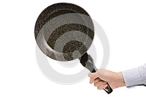 Man`s hand frying pan