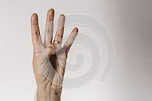 Man`s hand gesture, counting number four, isolated on white background - part of set