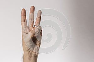 Man`s hand gesture, counting number three, isolated on white background - part of set