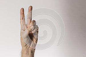 Man`s hand gesture, counting number two, isolated on white background - part of set