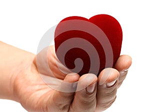 Man's hand gifting heart