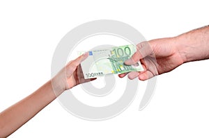 Man's hand gives a the bill 100 euro in a child's hand
