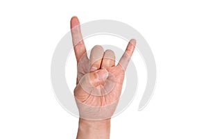 A man`s hand giving the Rock and Roll sign. photo