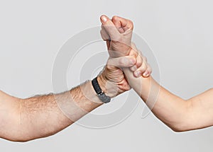 Man's hand grabbed a woman's hand. Concept of gender-based violence and mistreatment of women