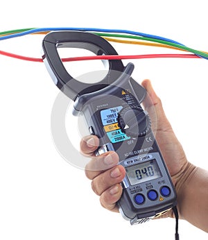 Man's hand hold AC and DC clamp meter