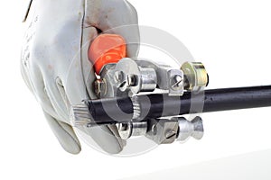 Man's hand hold stripper and high voltage cable