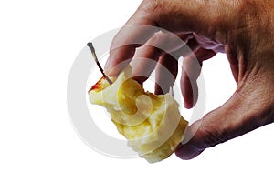 Man's hand holding an apple core with clipping path isolated on white background