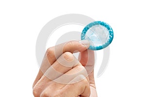 Man's hand holding condom isolated on a white background - clipping paths