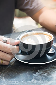 Man`s hand holding cup of coffee, Lifestyle