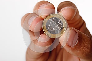 Man`s hand holding euro coin