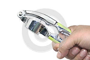 Man's hand holding Grinding hard shell crab tool, crushed garlic