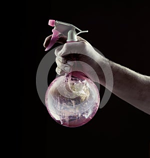 Man`s hand holding a spray flacon