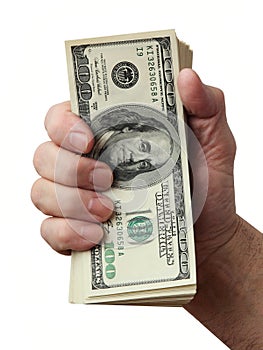 Man's hand holding a stack of american hundred dollar bills