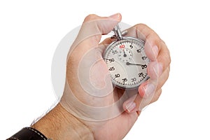 A man's hand holding a stop watch