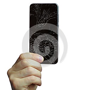 A man's hand holds a black phone with a broken screen. Isolated on a white background.