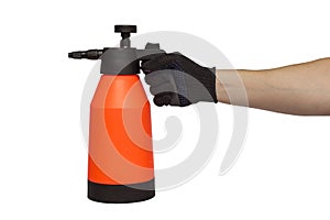 A man`s hand holds hand-pumped sprayer isolated on white background. Garden pressure sprayer for dispensing fertilizer, pesticide