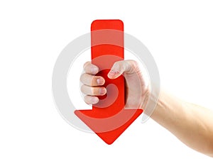 A man`s hand holds a large red arrow. Close up. Isolated on a wh