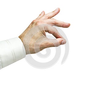 Man`s hand holds an object with his thumb and forefinger