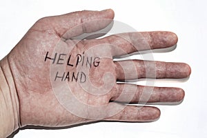 Man's hand isolated on white background. The text A helping hand is written on the palm