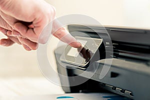 Man's hand making copies