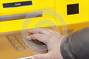 Man's hand near the cash machine