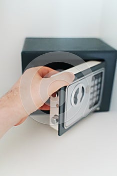 Man opening small safe